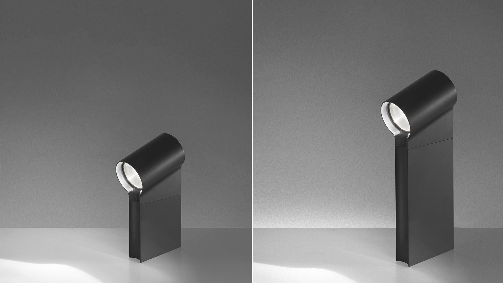 Artemide Oblique bollard lamp shown in two heights: short and tall versions in dark finish, cylindrical rotating head casting directional light