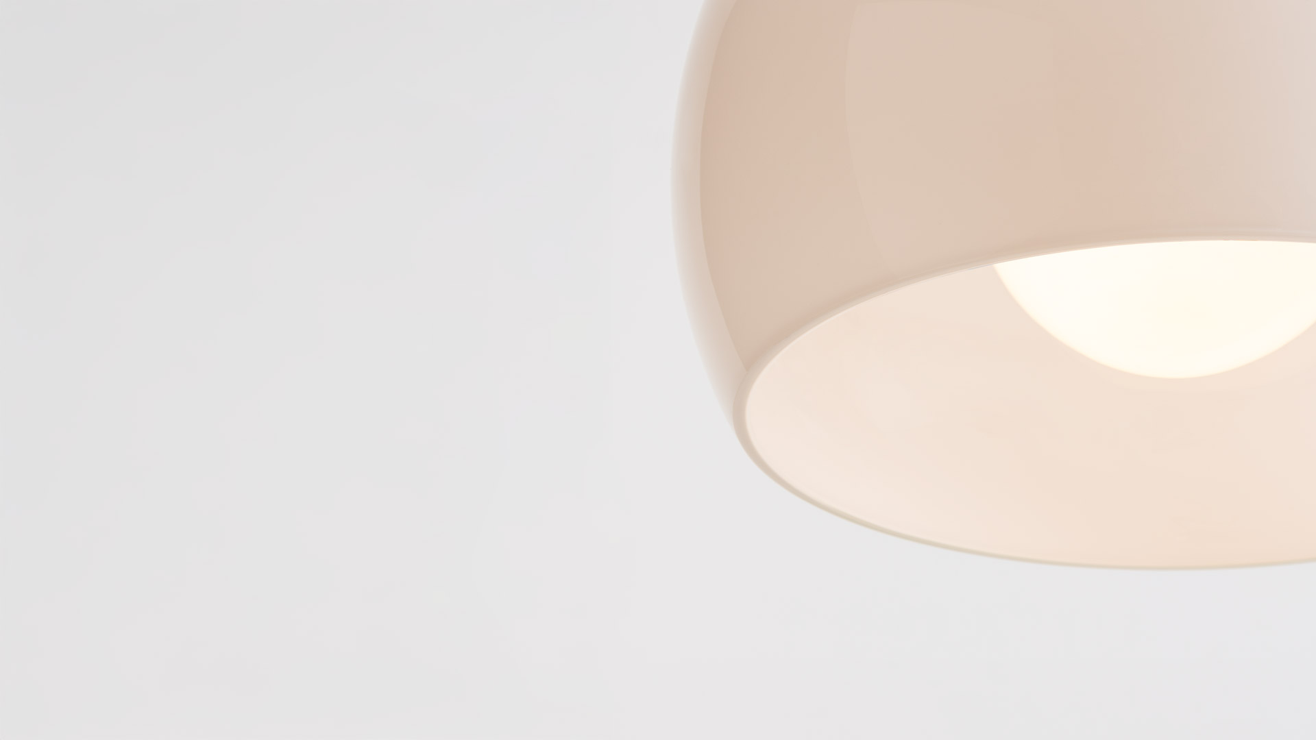 Artemide Omega lamps: floor lamp with chrome stem and pendant lamp, both featuring wide white opal glass shades on grey background