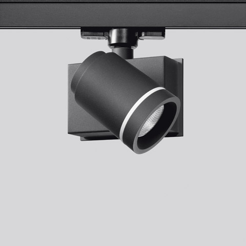 Artemide Picto 70 track spotlight in matte black, cylindrical head with LED lens, mounted on ceiling rail system