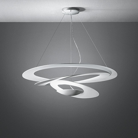 Artemide Pirce pendant lamp in white, featuring a sculptural spiral design suspended from the ceiling by thin steel cables