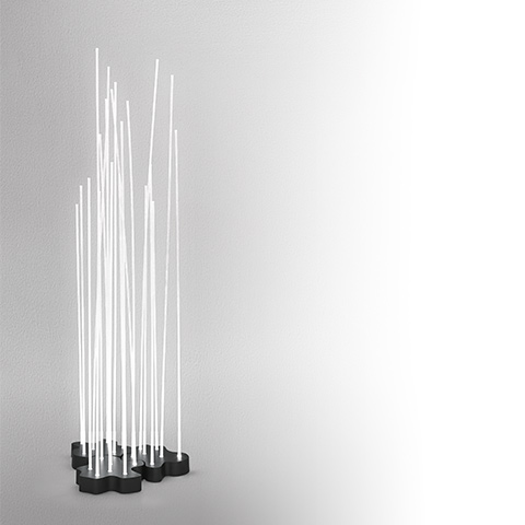 Artemide Reeds IP20 floor lamp: multiple white luminous rods of varying heights rising from clustered dark bases