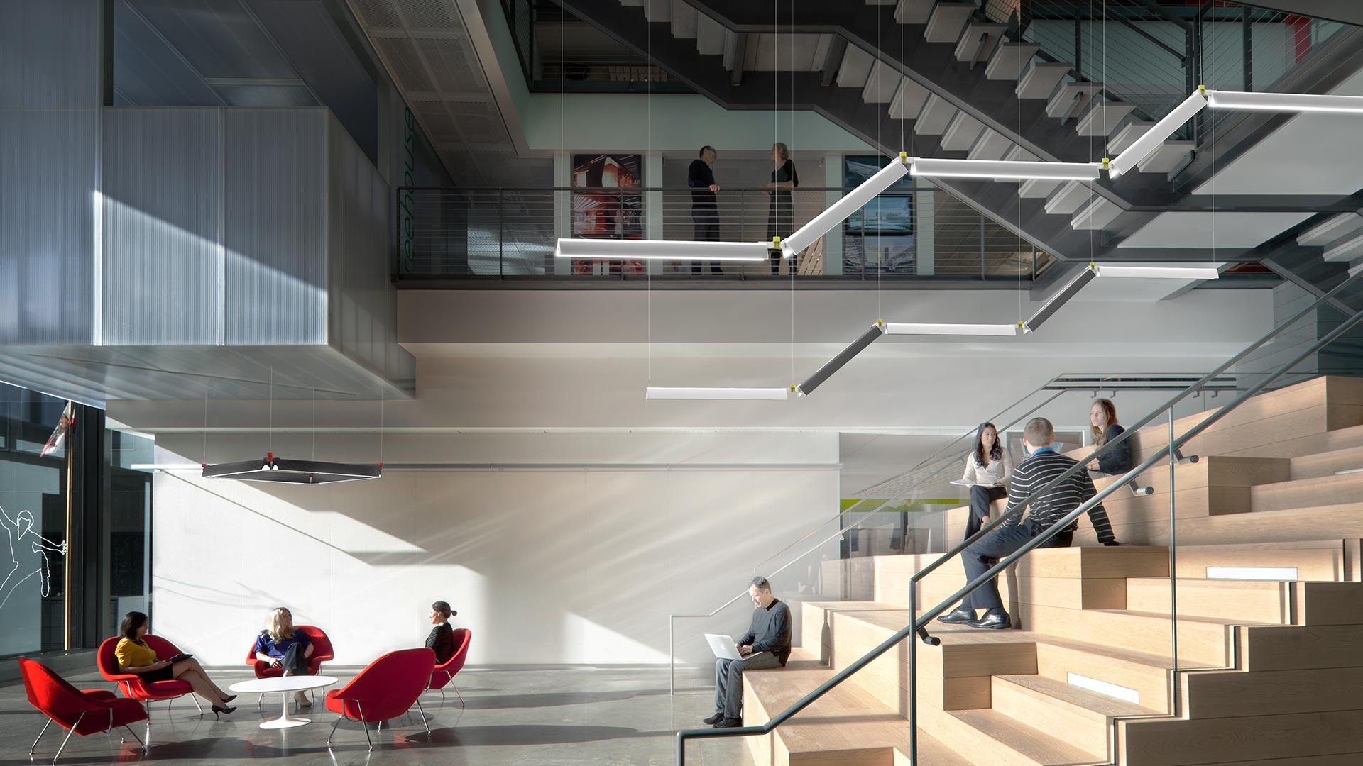 Artemide Series Y pendant lighting system with red cross-shaped junction connector linking diagonal white LED linear modules from ceiling