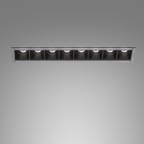 Artemide Sharp Refractive Emission: recessed linear ceiling fixture with 8 black square cells and LED light sources in silver trim