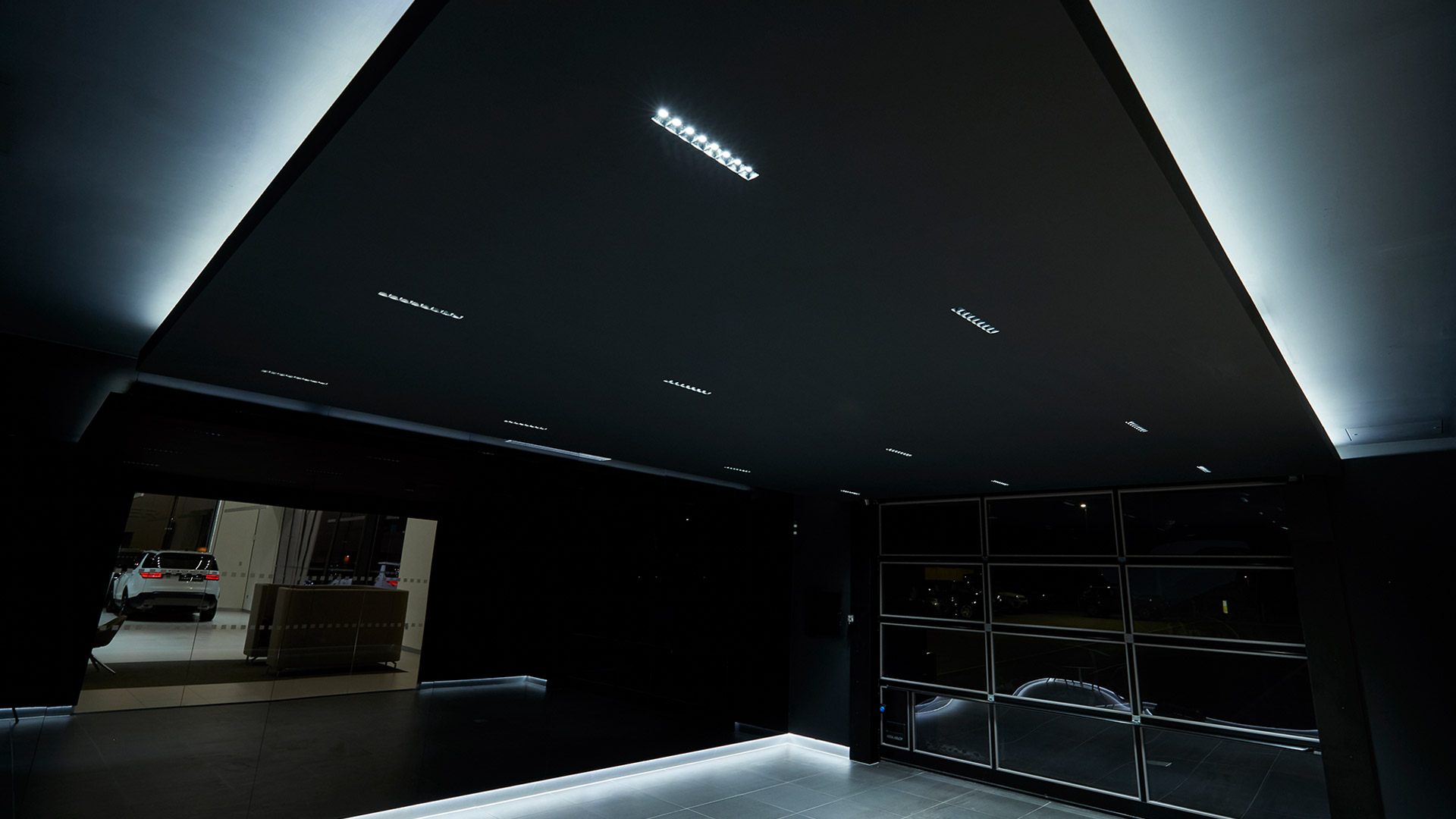 Artemide Sharp LED recessed spotlight with three square modules featuring ribbed reflectors in a sleek black housing