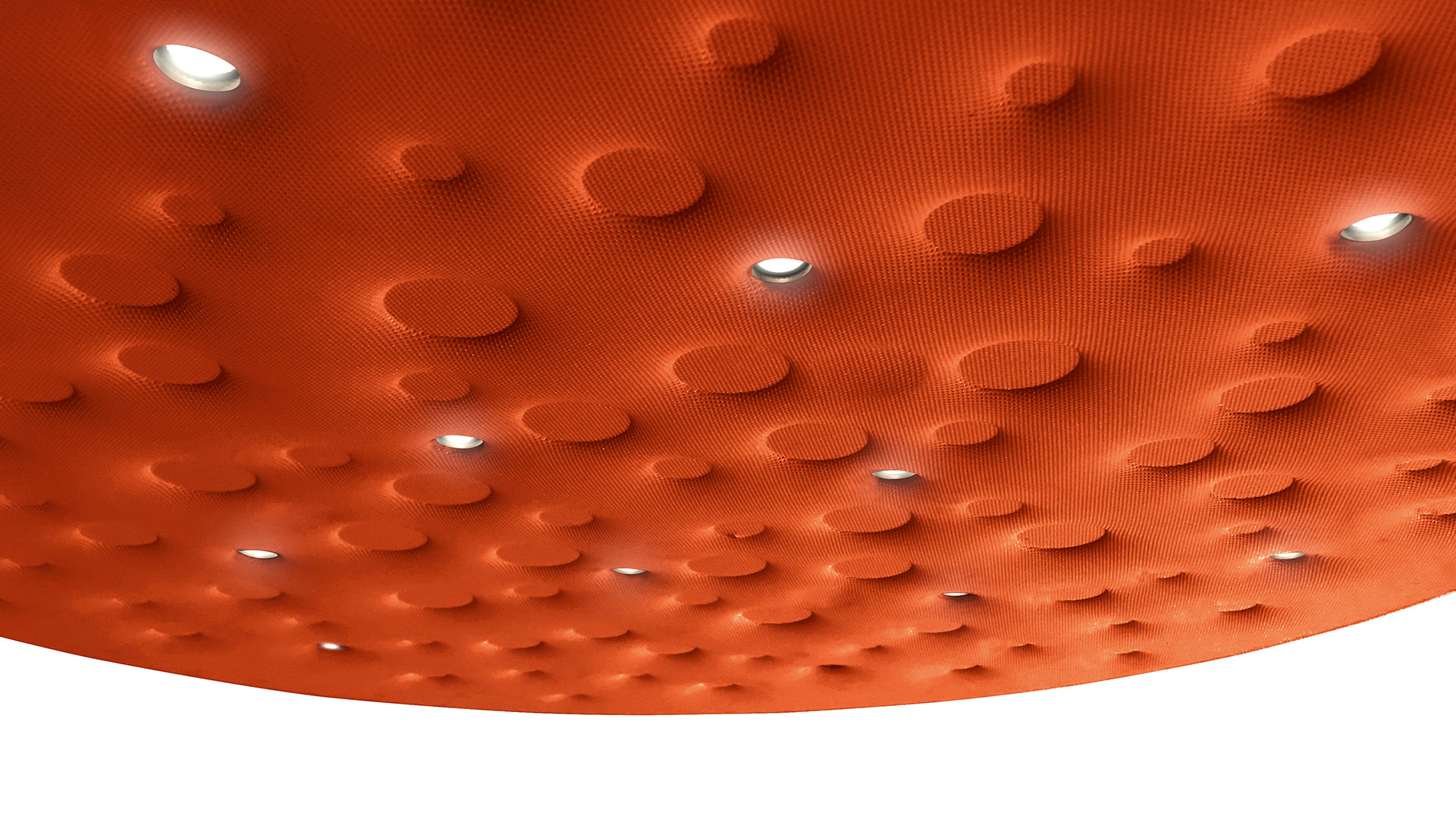 Artemide Silent Field 2.0 pendant lamps in white and orange with perforated disc shades suspended over a glass conference table