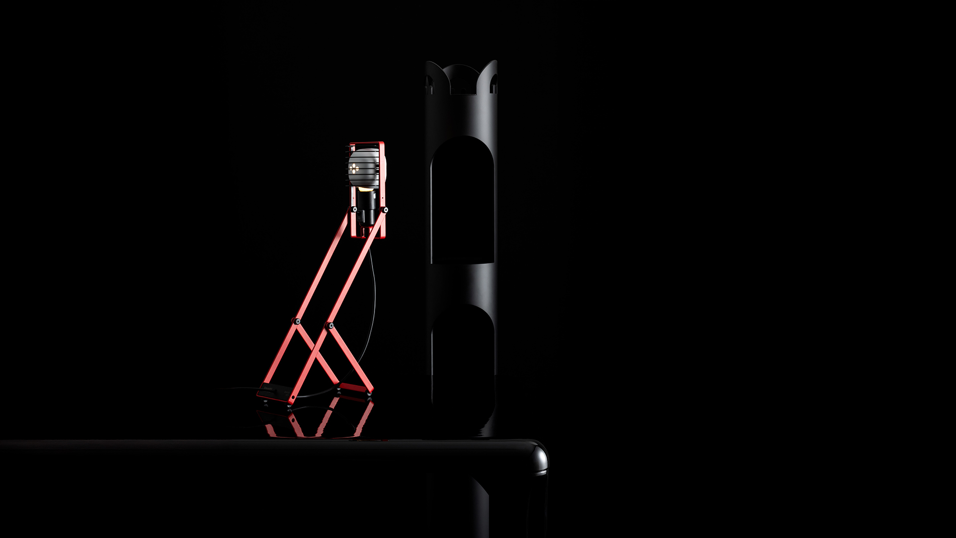 Artemide Sintesi red desk lamp with adjustable scissor-like arms and comb-shaped LED head, black power cord