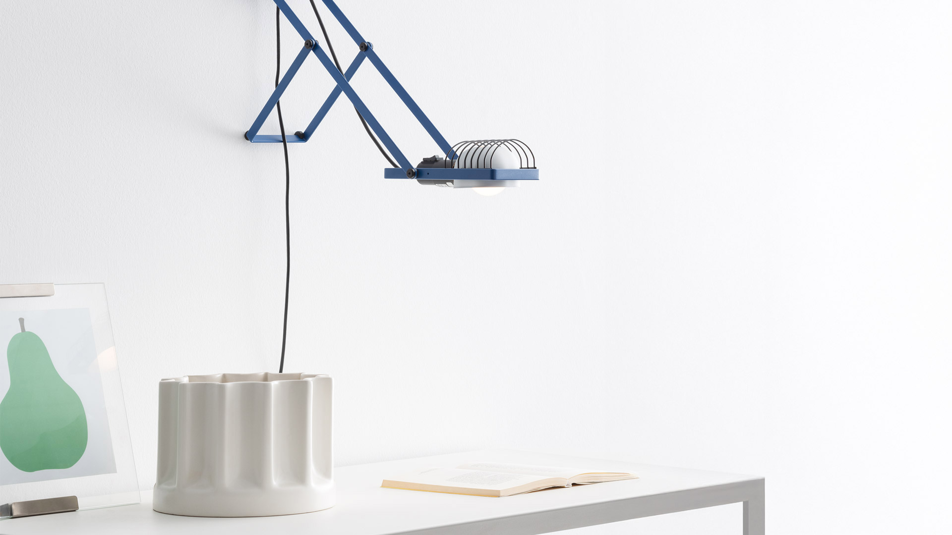 Four Artemide Sintesi floor lamps in green, red, white, and blue, featuring adjustable metal frames with grid shades and exposed bulbs