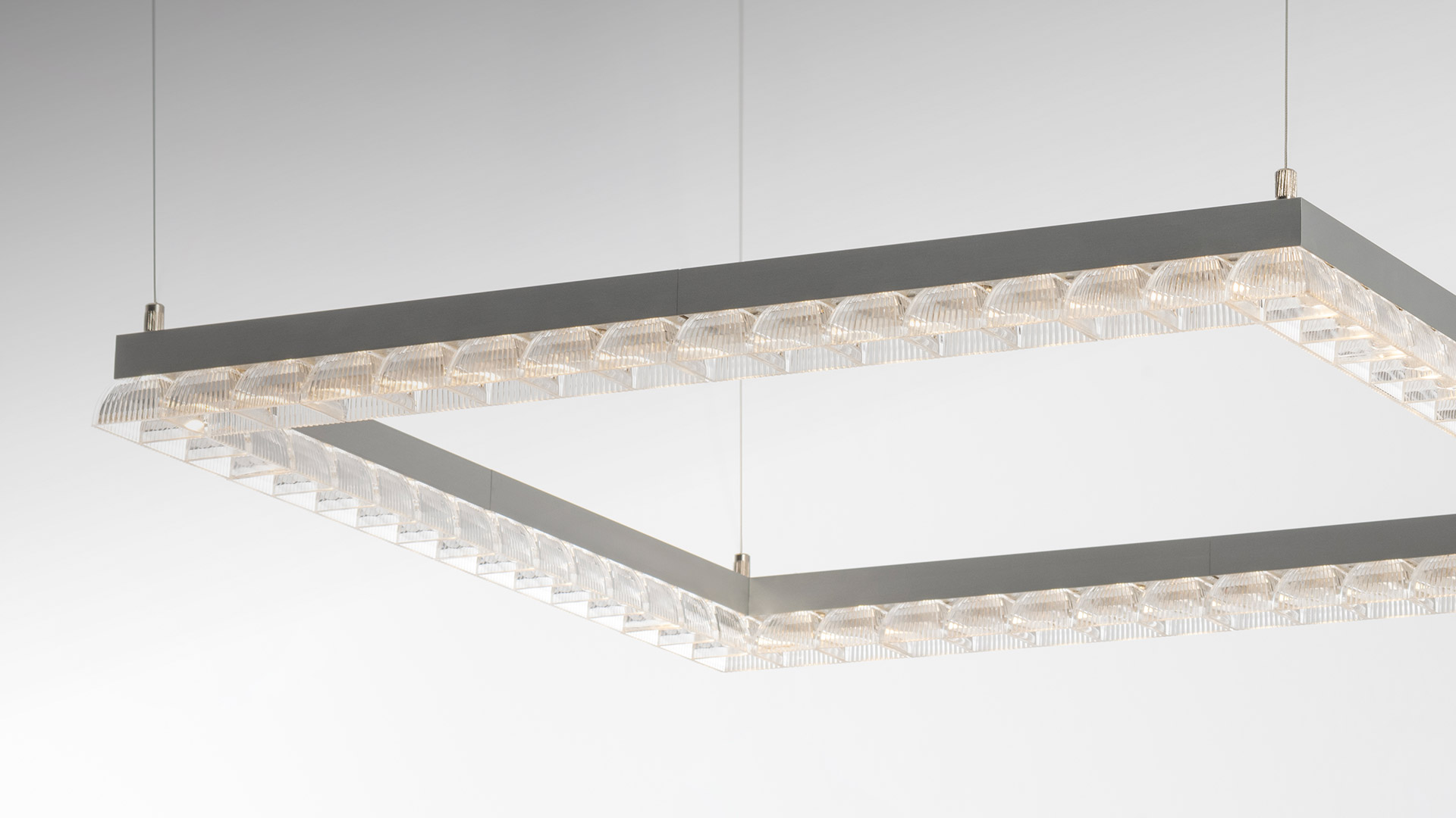 Artemide Somnĭum System: rectangular pendant light fixture in grey metal with crystal prismatic modules, suspended by thin cables