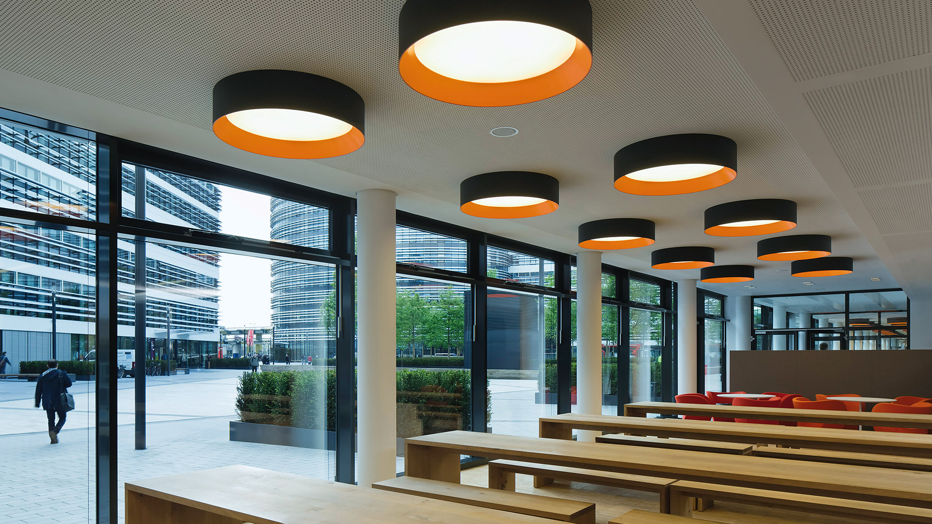 Artemide Tagora ceiling lights: cylindrical pendants and flush mounts in grey, black, taupe with contrasting green, orange inner shades