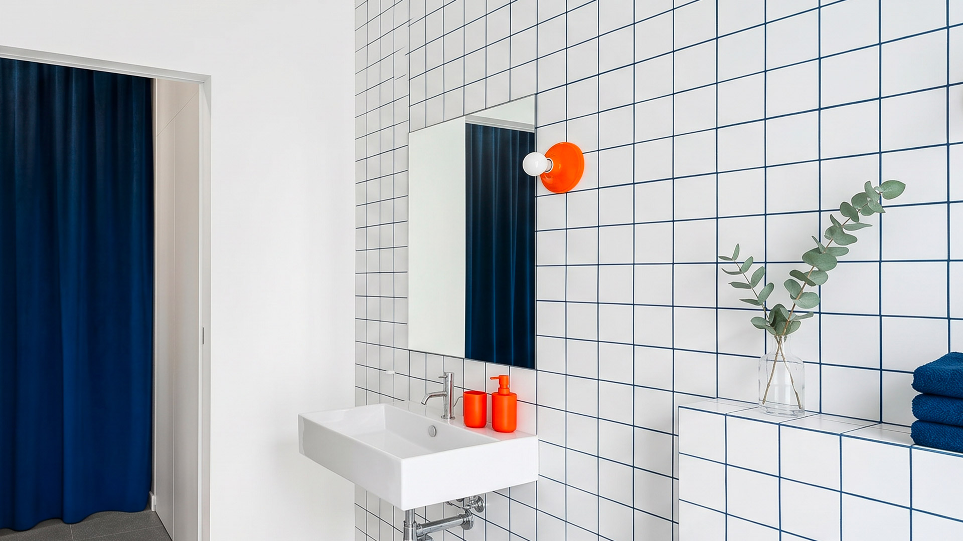 Five Artemide Teti wall lamps in donut shape, displayed in purple, blue, yellow, green, and cobalt blue finishes on white background