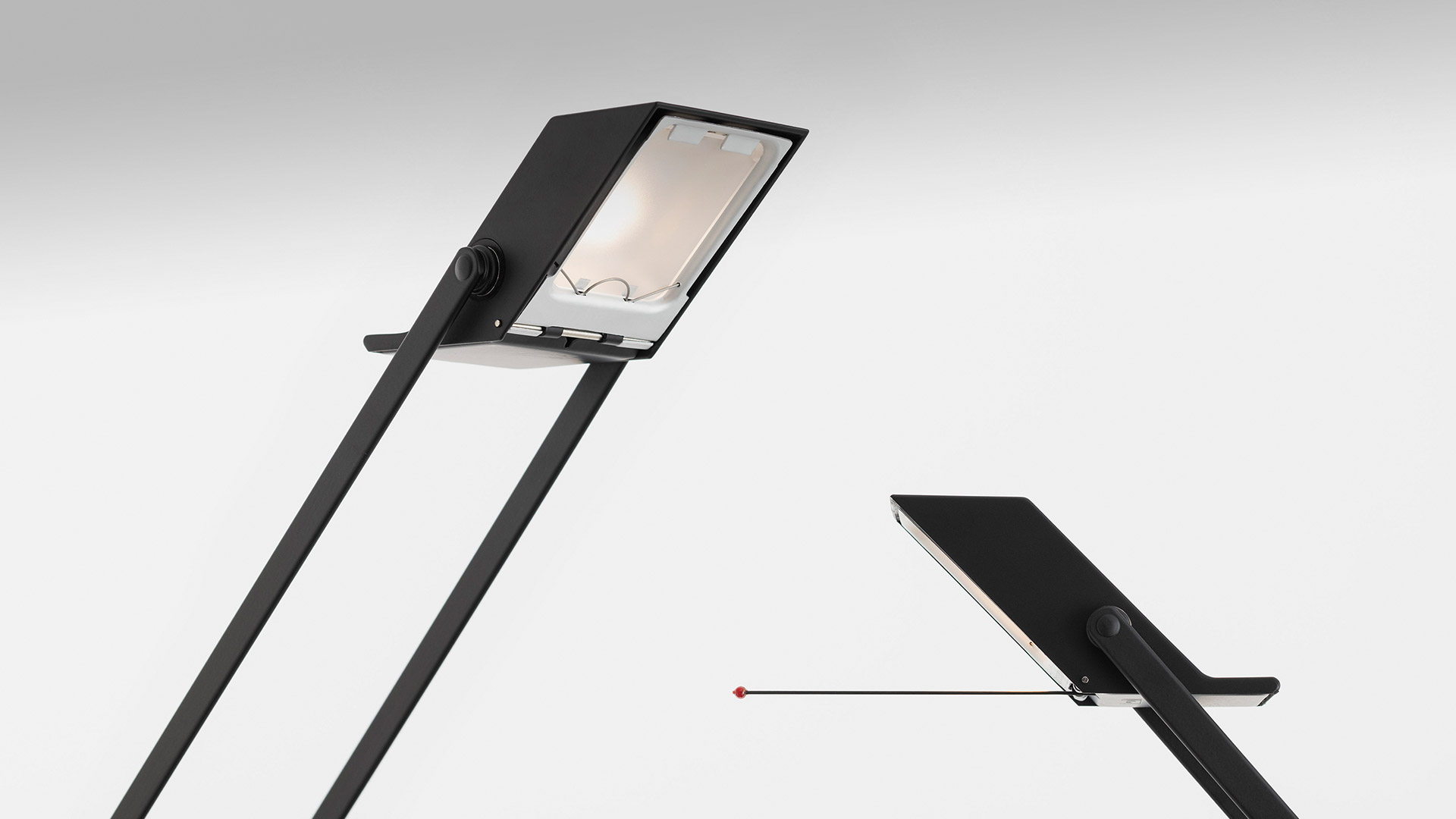Artemide Tizio floor lamp in matte black, showing adjustable rectangular head with counterbalance arm and pivot detail