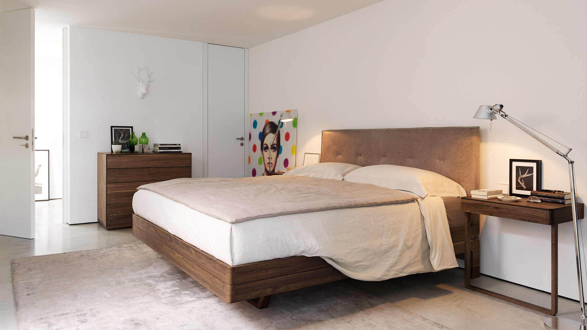 Modern bedroom with Artemide Tolomeo Terra floor lamp beside a walnut bed, providing focused reading light on the nightstand