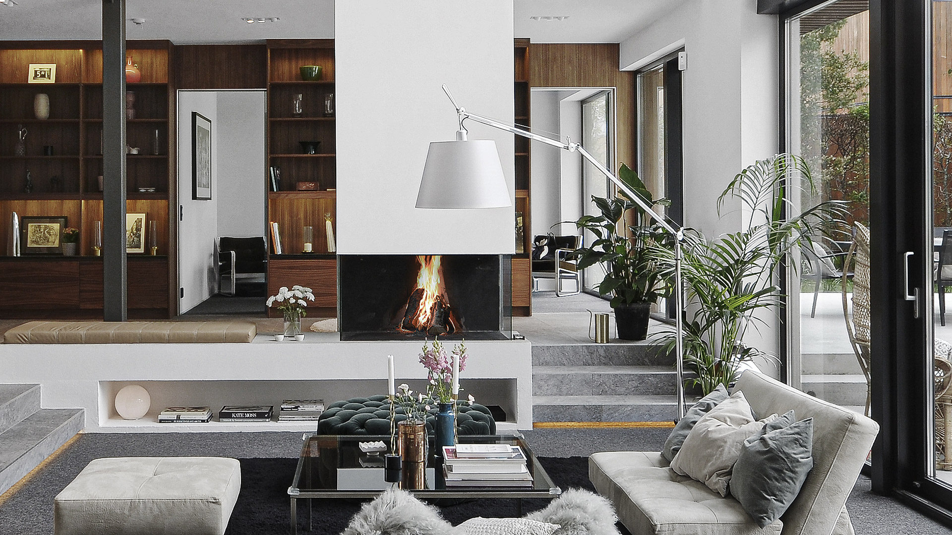Artemide Tolomeo Mega Terra floor lamp in three shade variants: white, light grey, and dark grey, with adjustable articulated arm