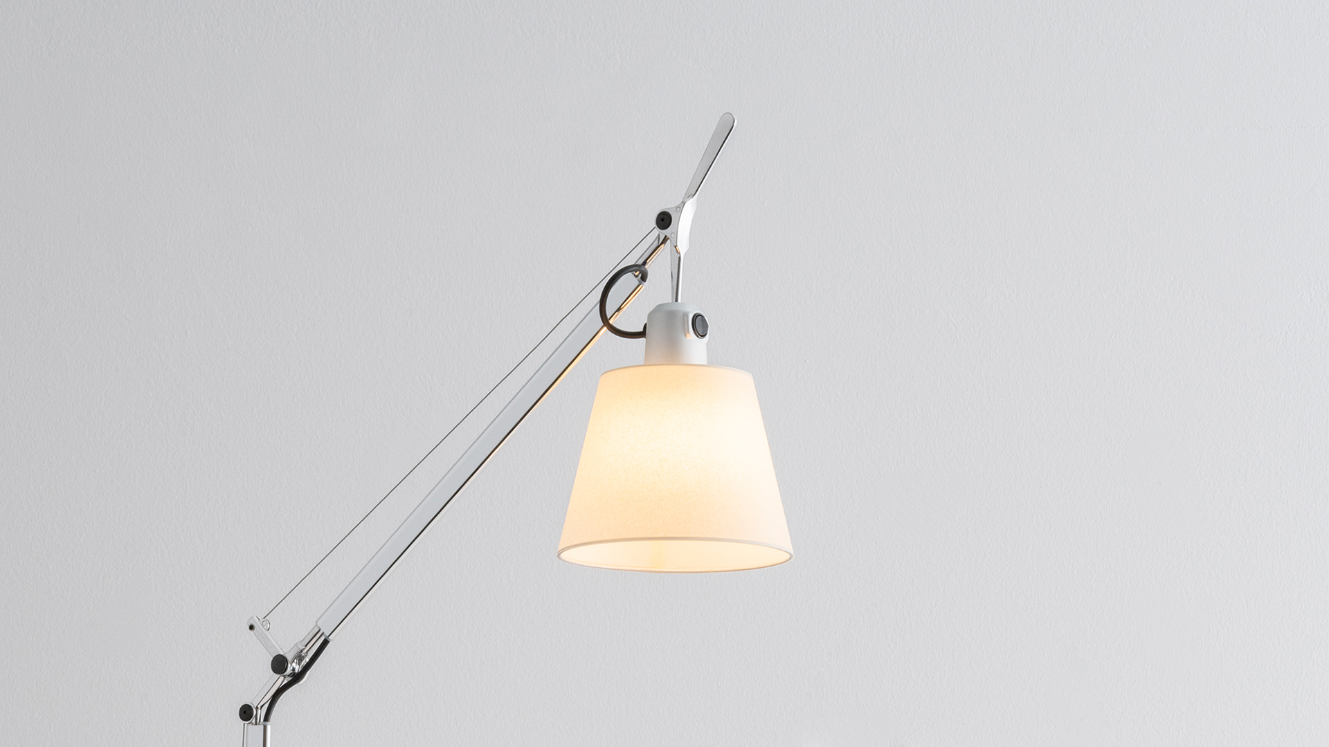 Artemide Tolomeo Basculante Reading Floor lamp with articulated aluminum arm and white diffuser shade, shown against neutral background