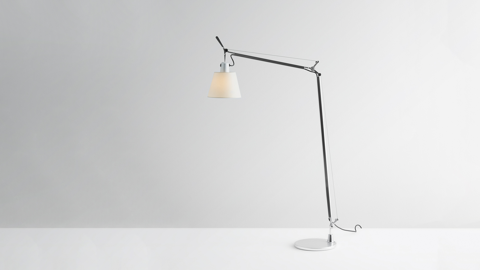 Artemide Tolomeo Basculante Reading Floor lamp: adjustable aluminum arm with conical white fabric shade on circular base