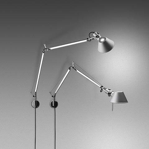 Two Artemide Tolomeo Parete wall lamps in polished aluminium with adjustable articulated arms and conical shades, wall-mounted