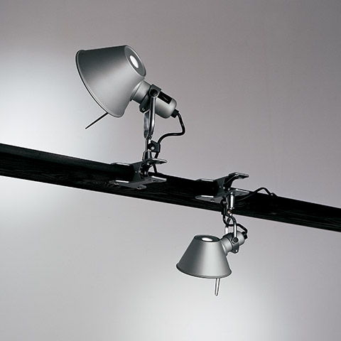 Artemide Tolomeo Pinza clip lamps in aluminum: one mounted upright on a beam, one hanging inverted, both with conical shades