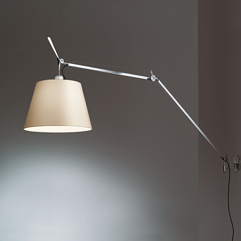 Artemide Tolomeo Mega Parete wall lamp with adjustable aluminum arm and large beige fabric shade, mounted on grey wall