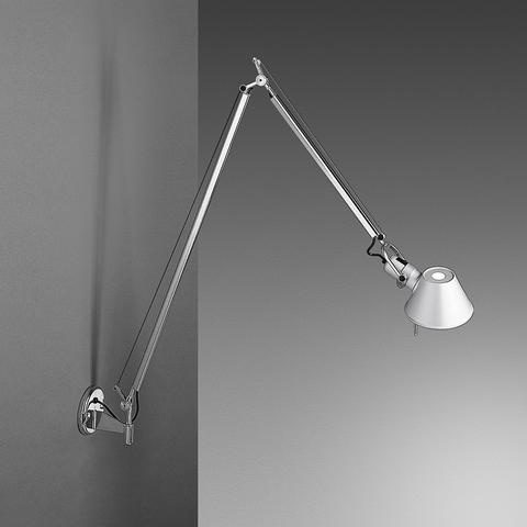 Artemide Tolomeo Parete wall lamp in aluminium with double adjustable arm and conical shade, mounted on a grey wall