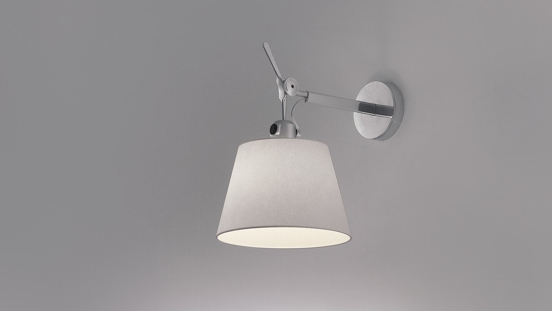 Artemide Tolomeo Parete wall lamps with white fabric shades and chrome wall mounts, shown in single and double configurations
