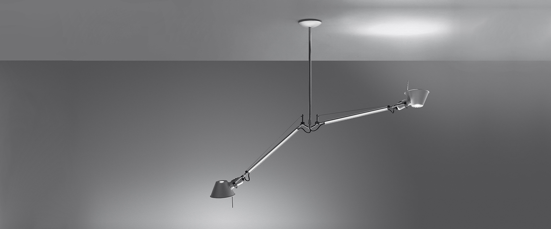 Artemide Tolomeo Due Bracci Sospensione: ceiling-mounted double-arm adjustable lamp in aluminum with two pivoting heads
