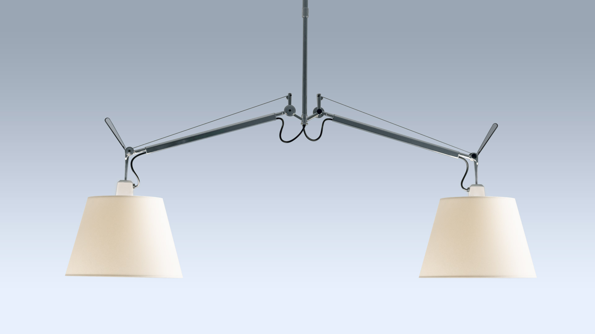 Tolomeo Basculante Sospensione Due Bracci with two white shades suspended over a conference table in a modern office.