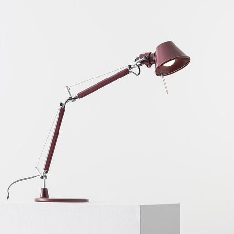 Artemide Tolomeo Micro Tavolo desk lamp in burgundy red, featuring articulated double-arm design with conical shade and tension cables