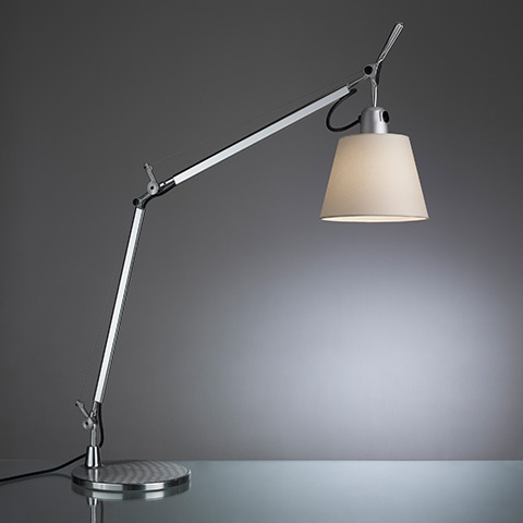 Artemide Tolomeo Basculante table lamp with adjustable aluminum arm, pivot joints, and tapered fabric shade on circular base