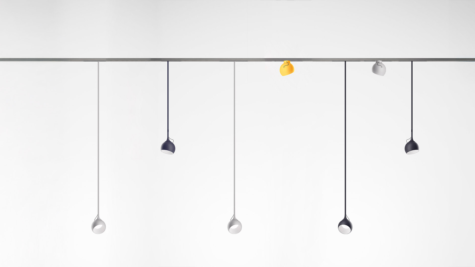 Artemide Turn Around System: curved suspended track light in dark metal with integrated LED spotlights and adjustable pendants
