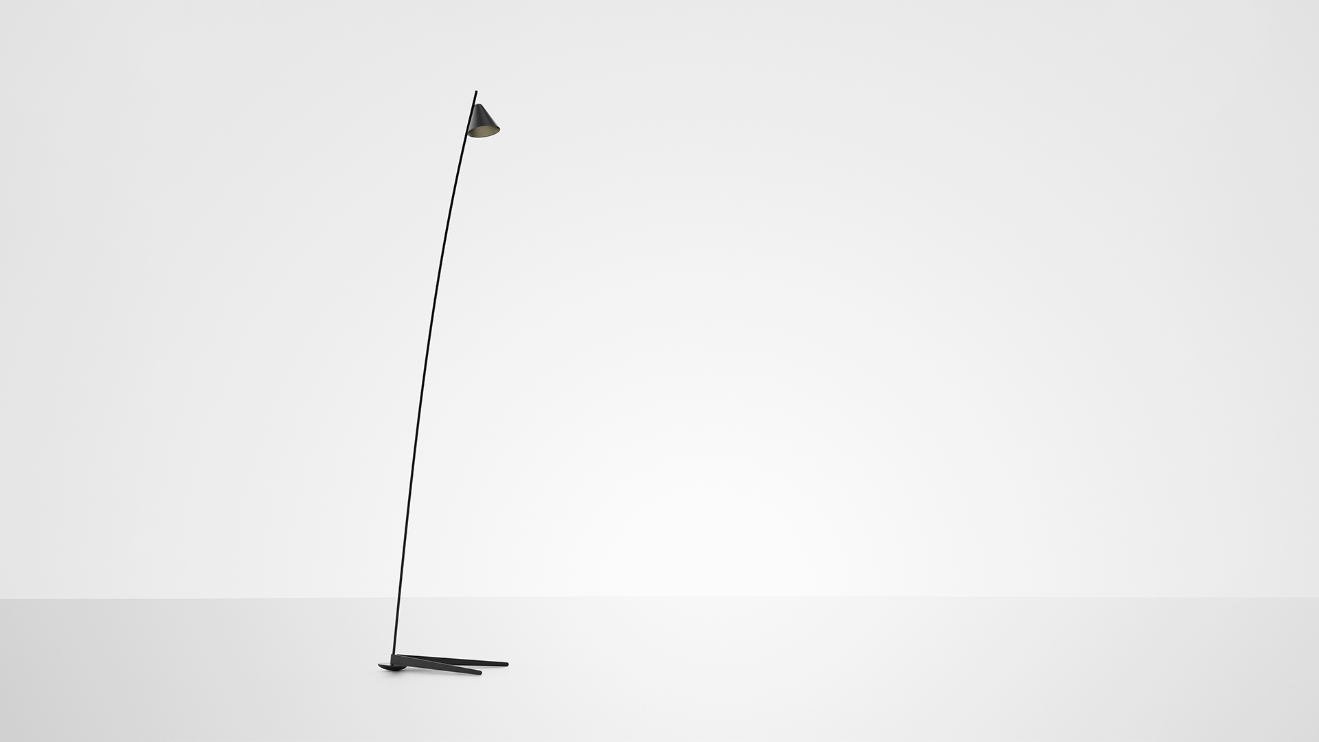 Artemide Vea floor lamp: slender black stem angled diagonally with small conical shade, resting on a minimal tripod base