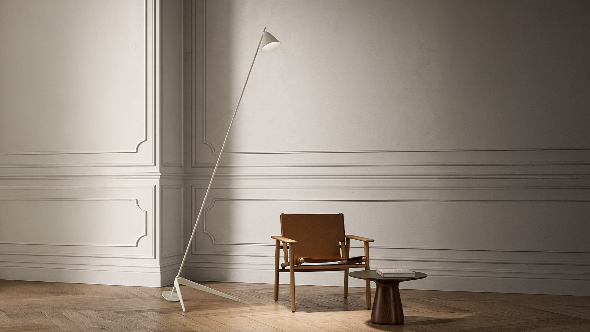 Artemide Vea floor lamp in white with adjustable arm and tripod base in a living room with wood-paneled walls and tufted sofa