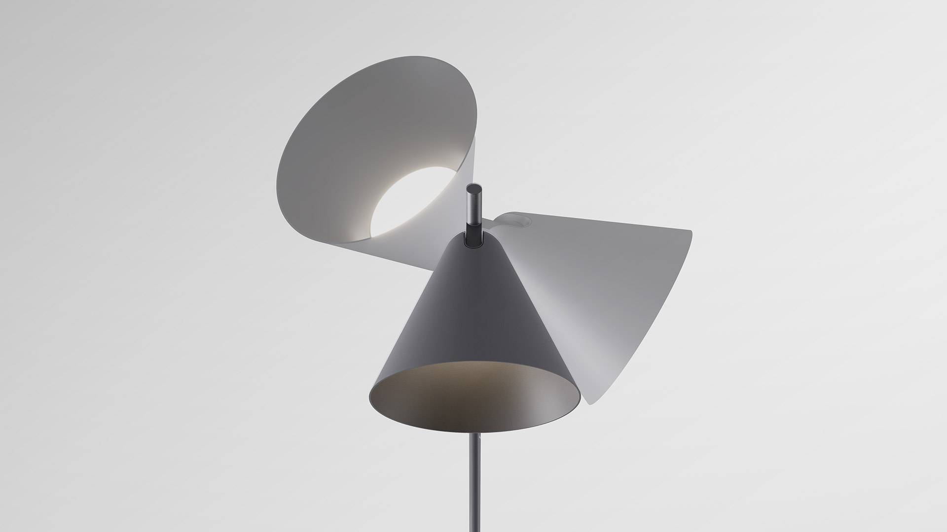 Two Artemide Vea floor lamps: tall black version left, shorter white version right, both with slim stem and tripod base