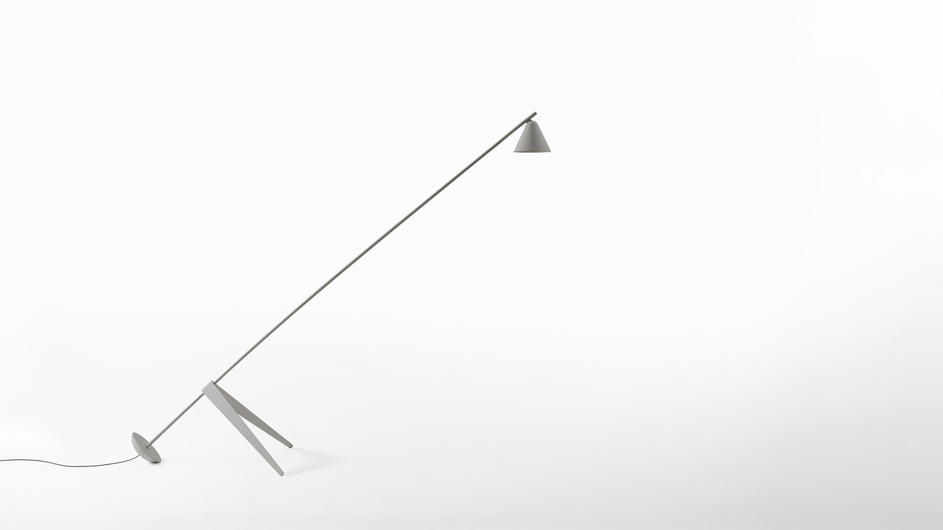 Artemide Vea floor lamp, top view showing circular white diffuser with warm glowing LED light source at center