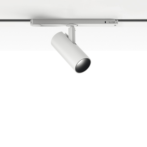 Artemide Vector Track 230V white cylindrical adjustable spotlight mounted on a track rail system for directional lighting