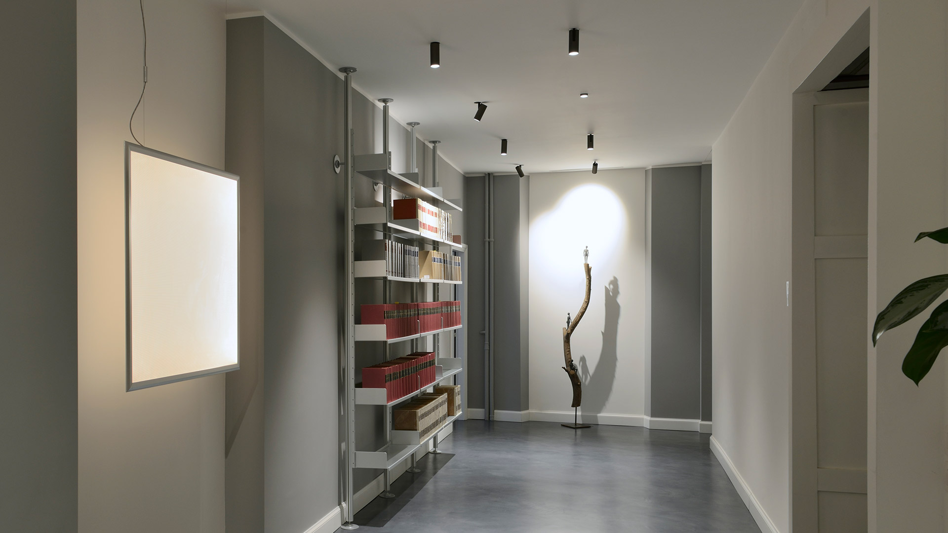 Artemide Vector Recessed ceiling spotlights: two flush black recessed fixtures and one adjustable tilted cylindrical white spotlight