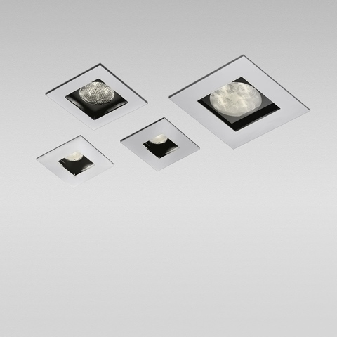 Four Artemide Zeno Up recessed LED spotlights in varying sizes, square white frames with black inner housing, ceiling-mounted