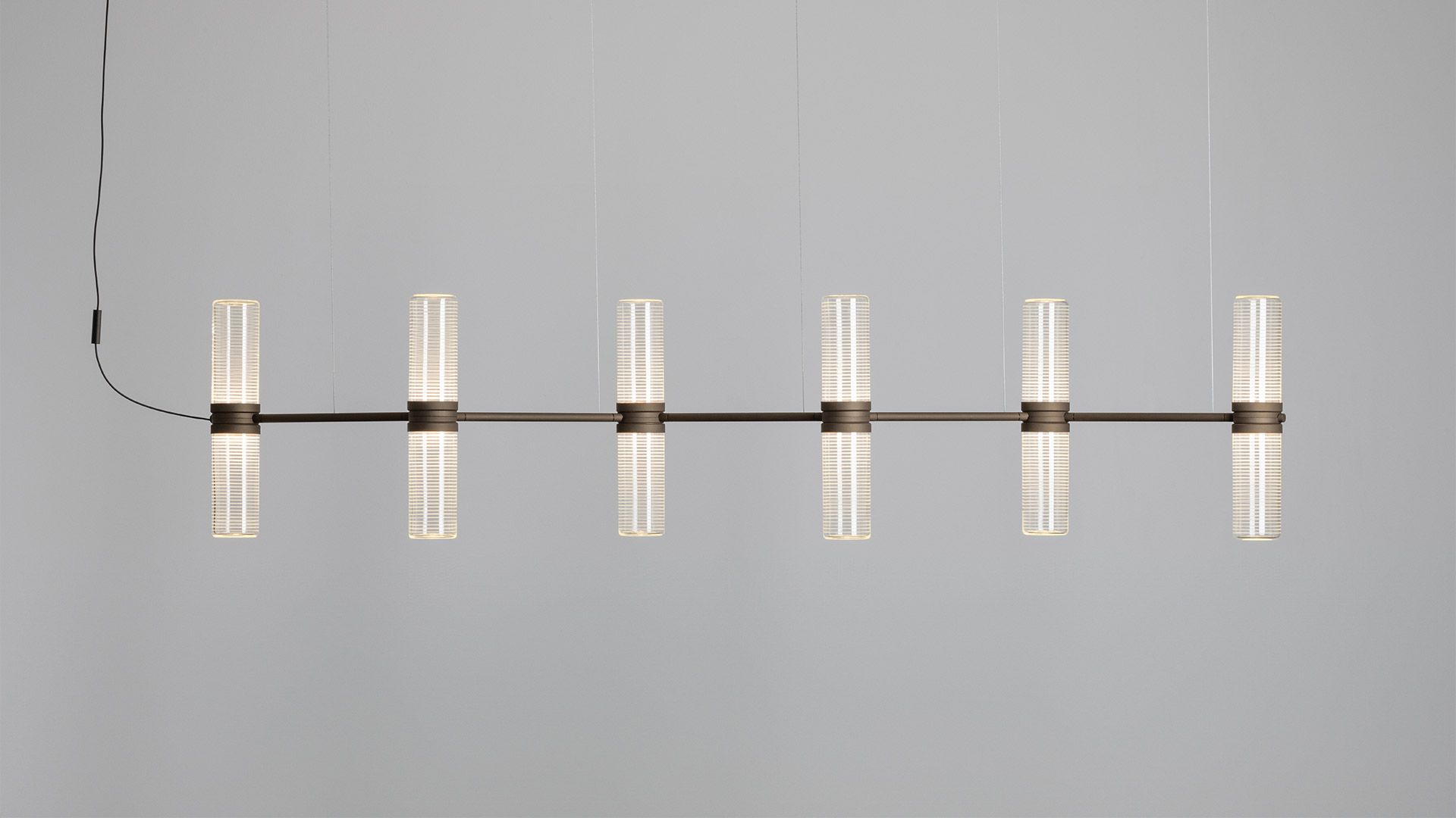 Artemide Zephyr pendant lamp: horizontal black metal bar with 8 frosted glass cylindrical diffusers arranged in pairs